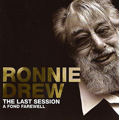 "CD cover with black background, older man's portrait, and gold and white text."