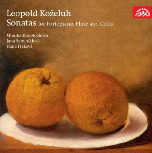"CD cover with two oranges on a plate, brown background, white text."