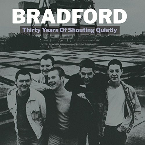 Black and white vinyl album cover featuring five men standing together outdoors.