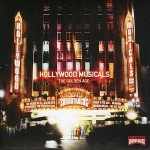 "Image of a brightly lit movie theater with 'Hollywood Musicals' sign at night."