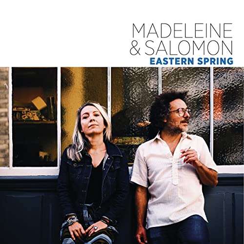 CD cover featuring a woman and man in front of a window.