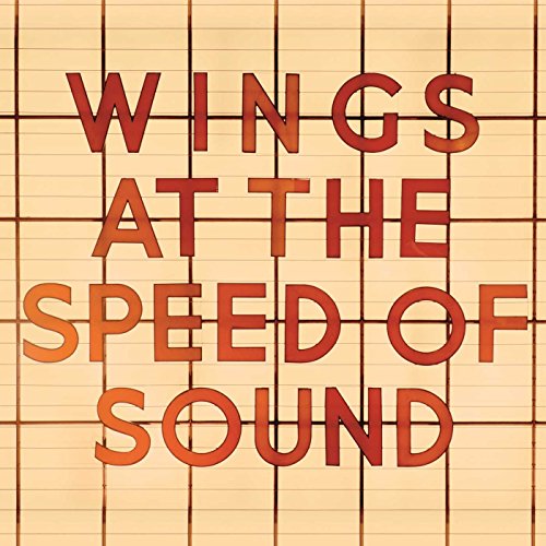 Album cover for Wings’ “At The Speed Of Sound” with orange text.