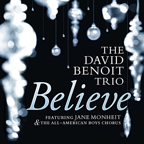 "Album cover with 'Believe' in large text, surrounded by hanging ornaments on black background."