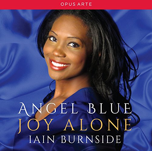 "CD cover featuring a smiling woman with dark hair against a blue satin background."
