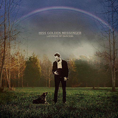 Album cover: man and dog under a rainbow in a field.