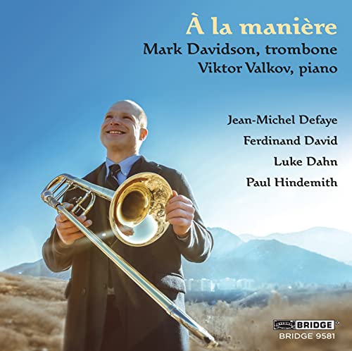 CD cover: Trombonist Mark Davidson with mountains in the background.