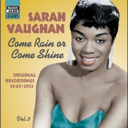 Sarah Vaughan's album cover featuring a smiling woman against a yellow background.