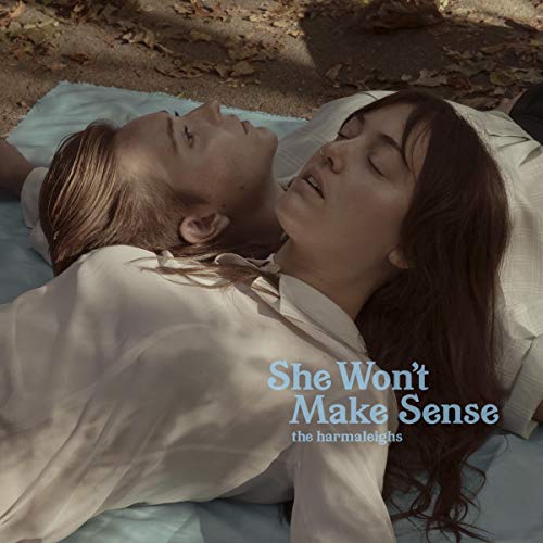 "Album cover featuring a man and woman lying on a blanket outdoors."