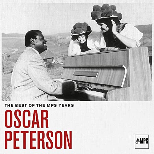 Oscar Peterson album cover: pianist with two women in hats outdoors.