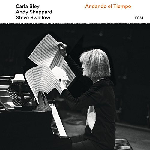 "CD cover featuring a black-and-white image of a woman at a piano."