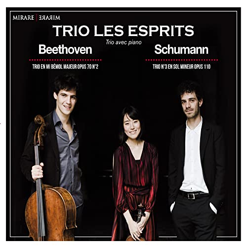CD cover featuring three musicians—cello, violin, and piano—in formal wear.