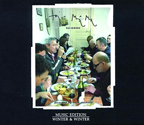 "CD cover with a photo of people dining around a long table."