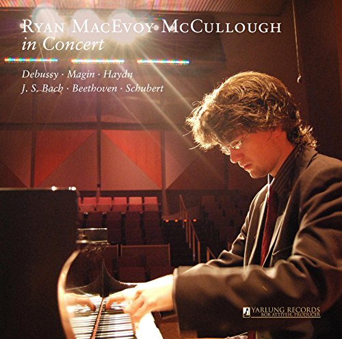 "CD cover featuring a man playing piano, with concert hall background and white text."