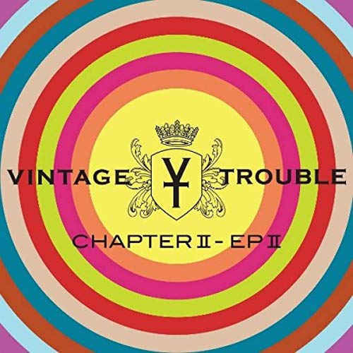 "Vintage Trouble album cover with multi-colored concentric circles and a crown emblem."
