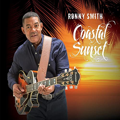 Ronny Smith playing an orange guitar against a sunset and palm trees.