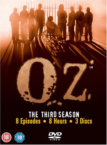 "Oz Season 3 DVD cover featuring prisoners and 'OZ' title in bold, distressed font."