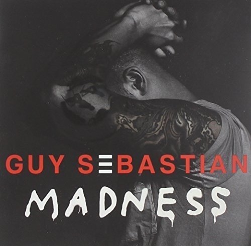 Album cover with man having arm raised, showing tattoos, and text "Guy Sebastian Madness".
