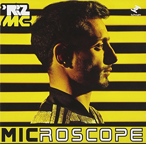 Album cover with a man's profile against yellow and black striped background.