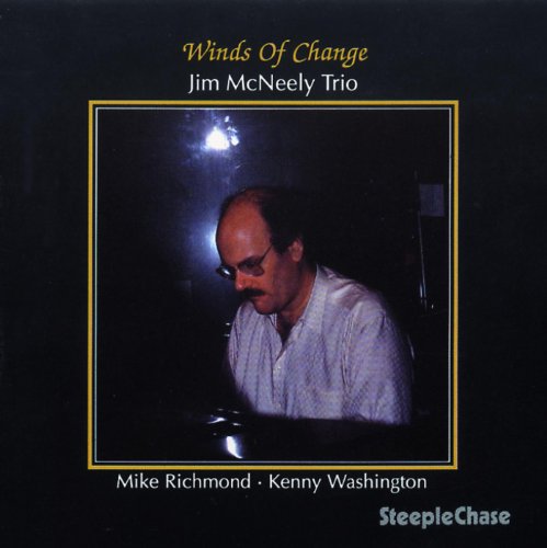 CD cover: Jim McNeely at a piano, dark background, gold trim.