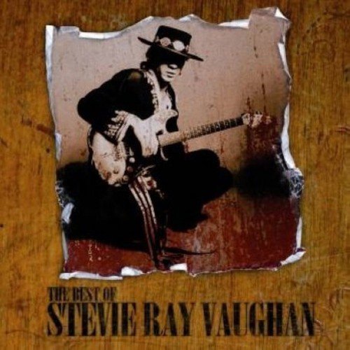 CD cover with a torn paper image of Stevie Ray Vaughan playing guitar.