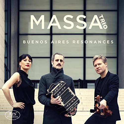 Three musicians with instruments stand before a modern building.