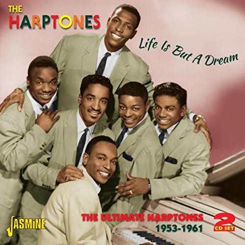 "Album cover with six men in suits posing around a piano."