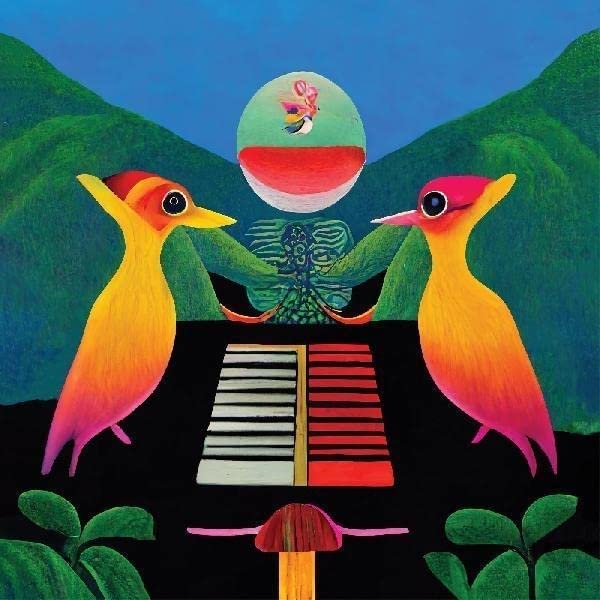 Album cover with colorful birds, a piano, and a glowing orb.