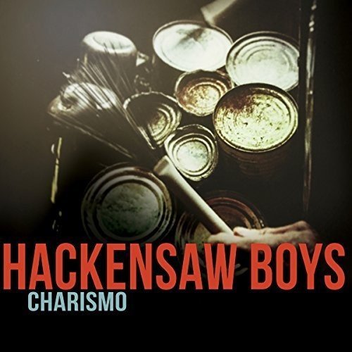 "Album cover with 'Hackensaw Boys - Charismo' text, featuring a hand holding drumsticks."