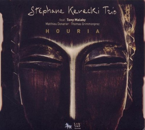 "Album cover featuring a dark wooden mask with closed eyes, titled 'Houria'."