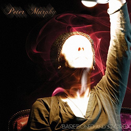 "Album cover with a man in a chair, arm raised, surrounded by red mist."