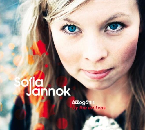CD cover featuring a close-up portrait of a woman with blue eyes.
