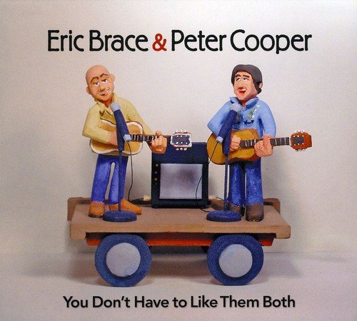 Album cover featuring cartoon musicians on a cart with guitars and amplifier.