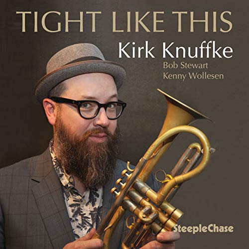"CD cover featuring a man holding a trumpet, wearing a fedora and glasses."