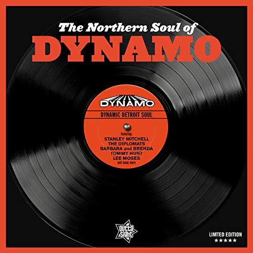 Black vinyl record with orange label and text on a black background.