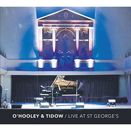 "CD cover featuring a grand piano on a stage with ornate backdrop."