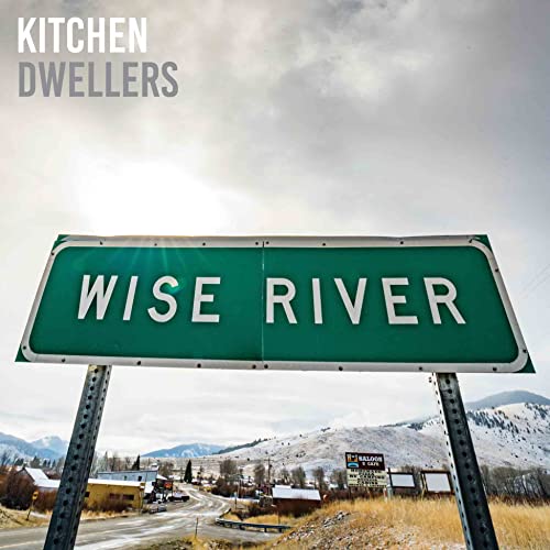 "Album cover with a green road sign reading 'Wise River' against a snowy landscape."
