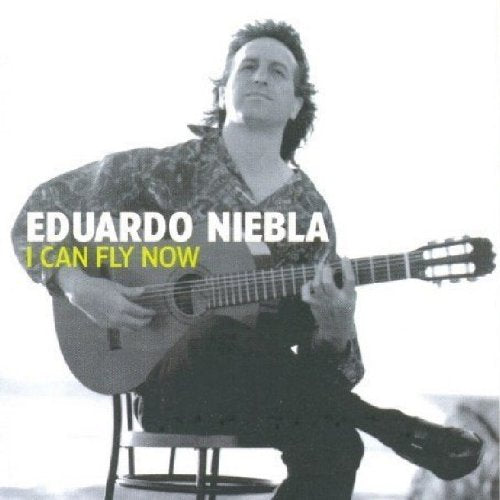 Man sitting on stool, playing guitar, with album title text overlay on a white background.