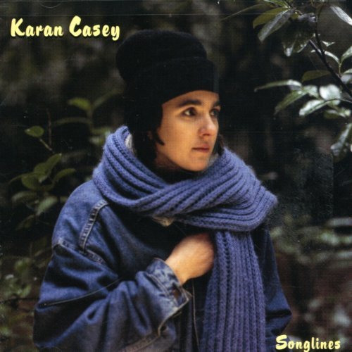 "Album cover featuring a woman in a dark jacket and purple scarf."