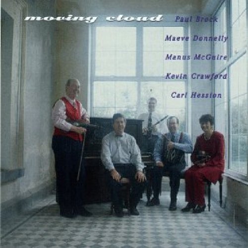 "Album cover with five men holding instruments in a room with large windows."