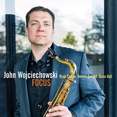 "Man in blue suit holding saxophone, album cover with text 'John Wojciechowski Focus'."