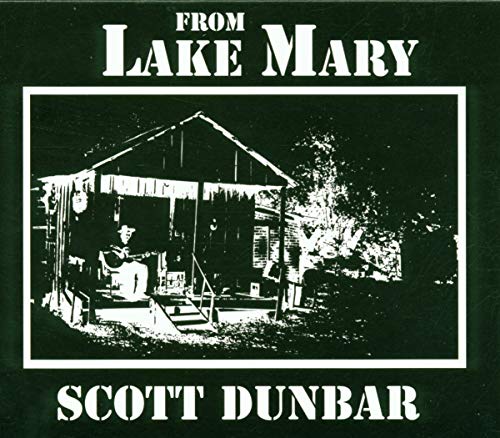 CD cover: black and white photo of a building and musician.