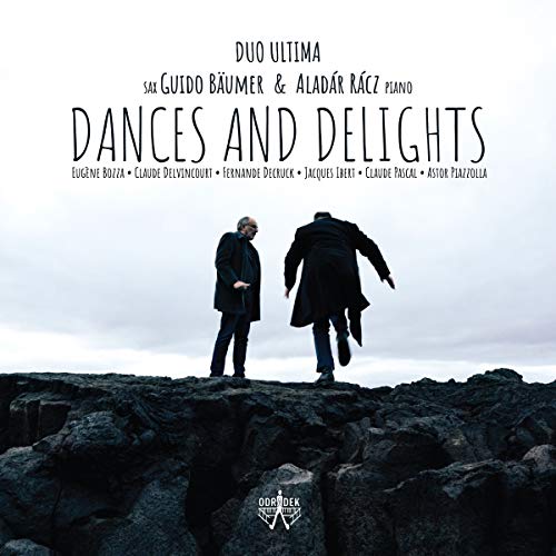 "Album cover with two men walking on dark rocks, gray sky, Duo Ultima logo."