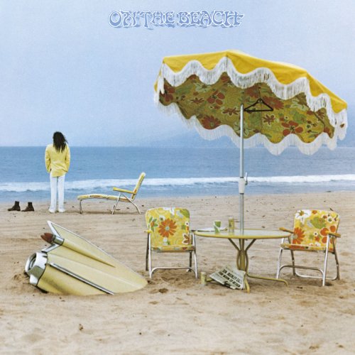 "Album cover: woman on beach with yellow patio set and surfboards, titled 'On the Beach'."