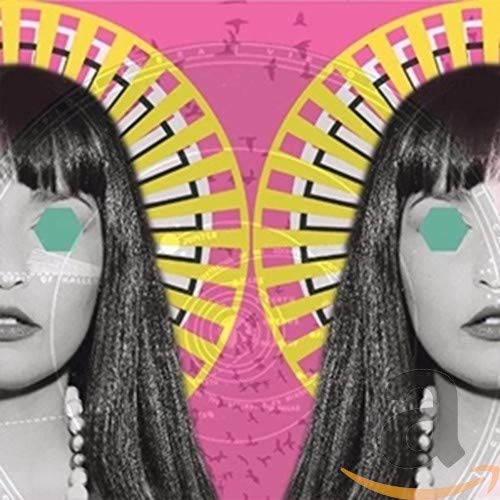 CD cover with mirrored portrait of a woman and geometric patterns.