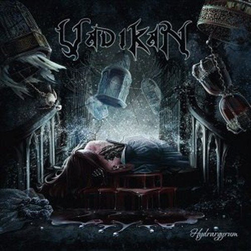 Dark album cover: man lying on table, surrounded by gothic architecture and hanging objects.