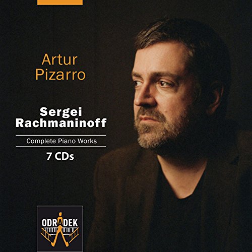 "CD cover featuring a man with dark hair and beard, black background, text, and logo."