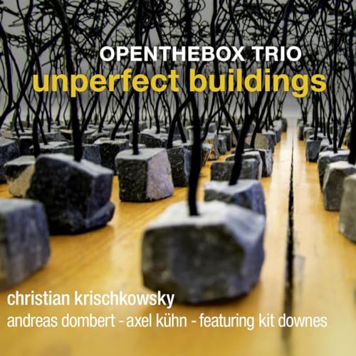 CD cover for "Unperfect Buildings" by Openthebox Trio, abstract stone structures.