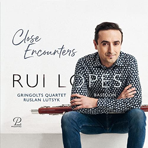 Album cover featuring a man with a bassoon and string quartet details.