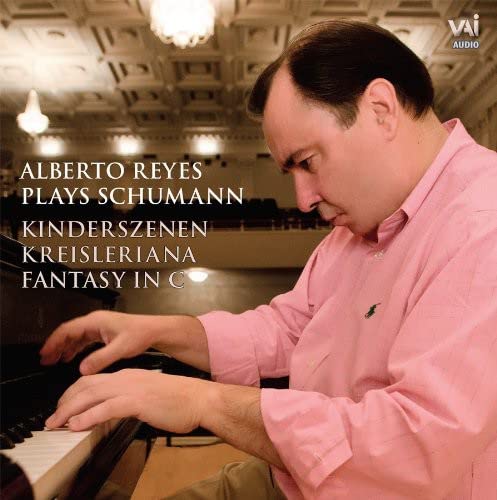 Alberto Reyes at a piano, CD cover for Schumann’s music.