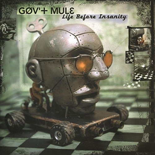"Album cover featuring a robotic head on wheels with glowing orange eyes."